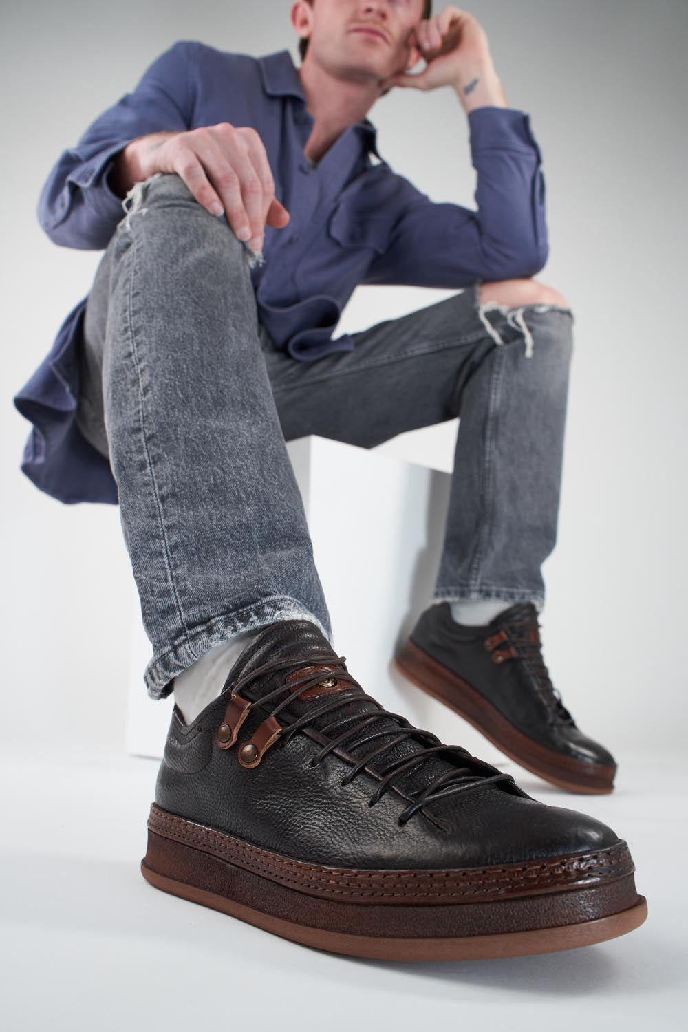 COLE dark-cocoa welted distressed sneakers.