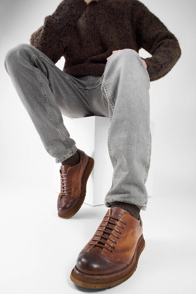 AJAX cognac distressed lightweight sneakers.