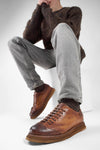 AJAX cognac distressed lightweight sneakers.