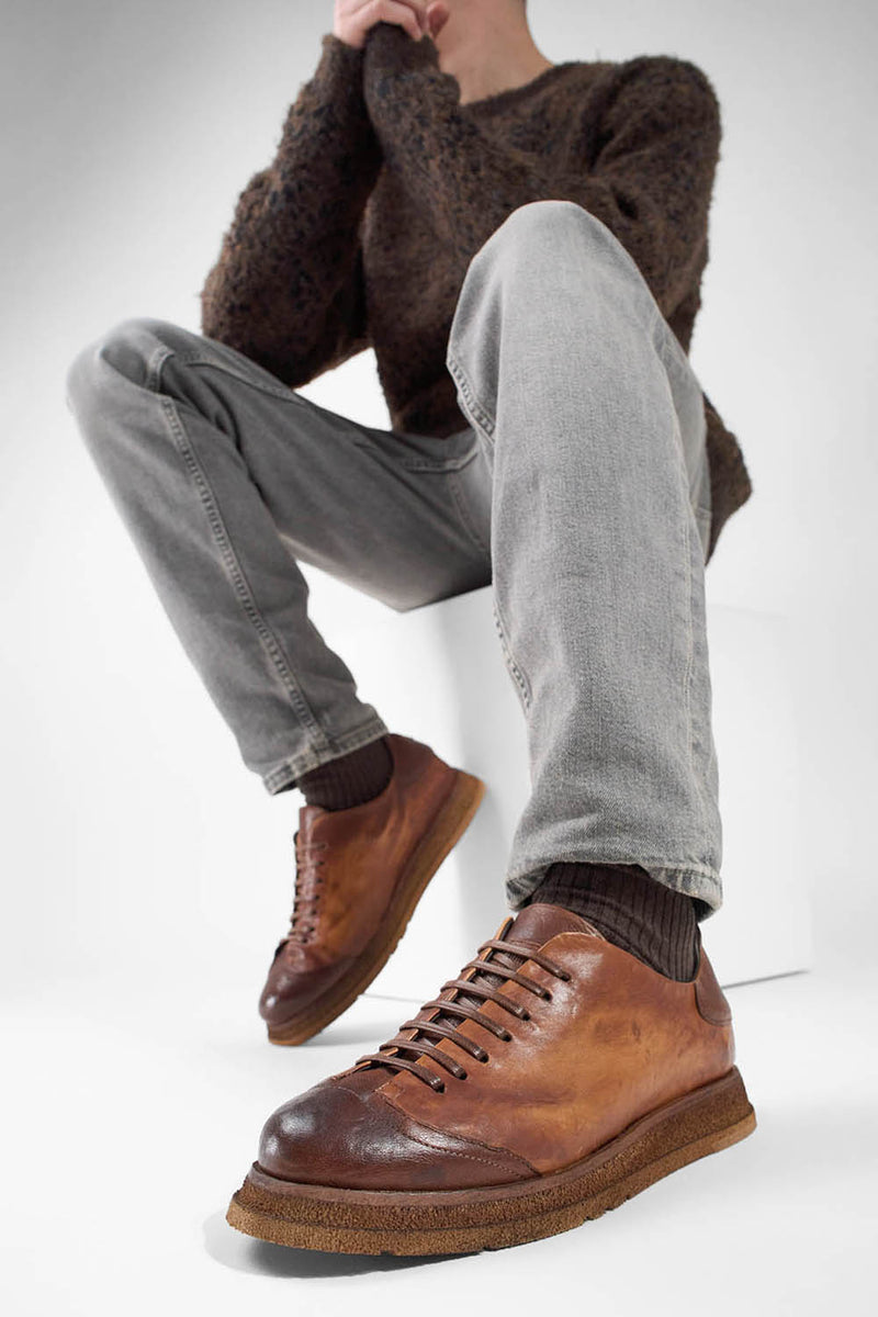 AJAX cognac distressed lightweight sneakers.