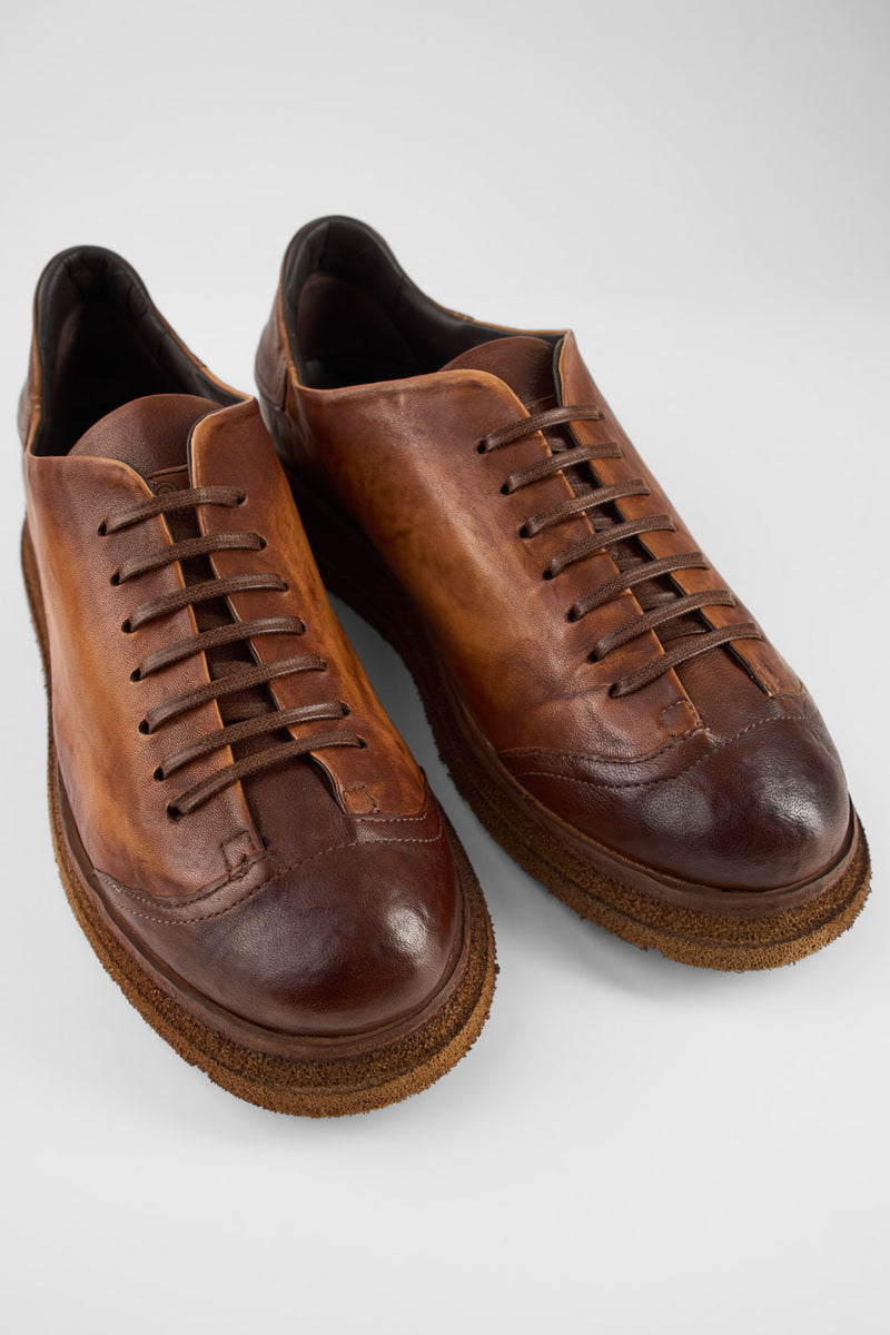 AJAX cognac distressed lightweight sneakers.