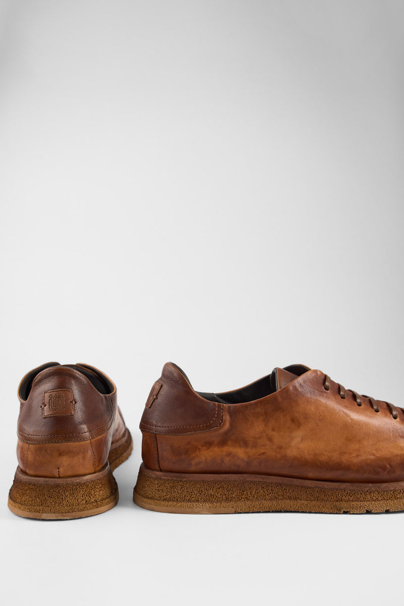 AJAX cognac distressed lightweight sneakers.