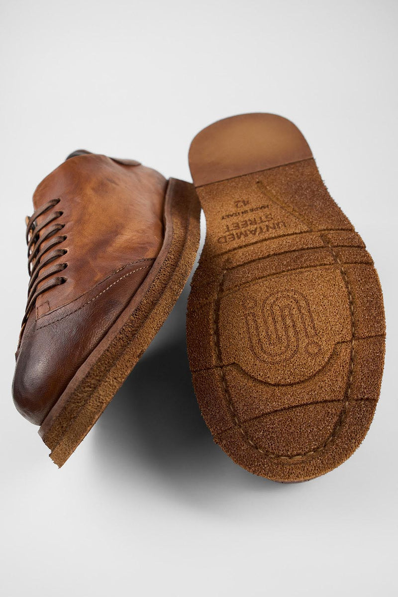 AJAX cognac distressed lightweight sneakers.