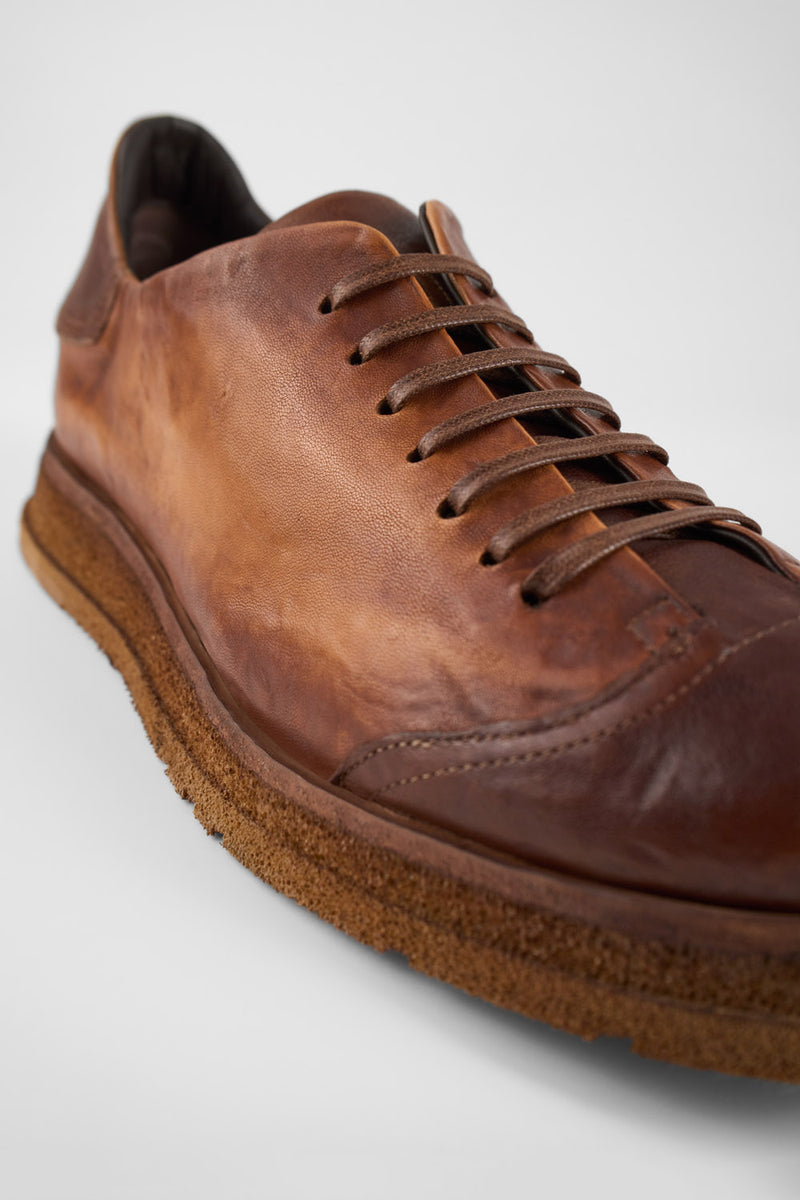 AJAX cognac distressed lightweight sneakers.