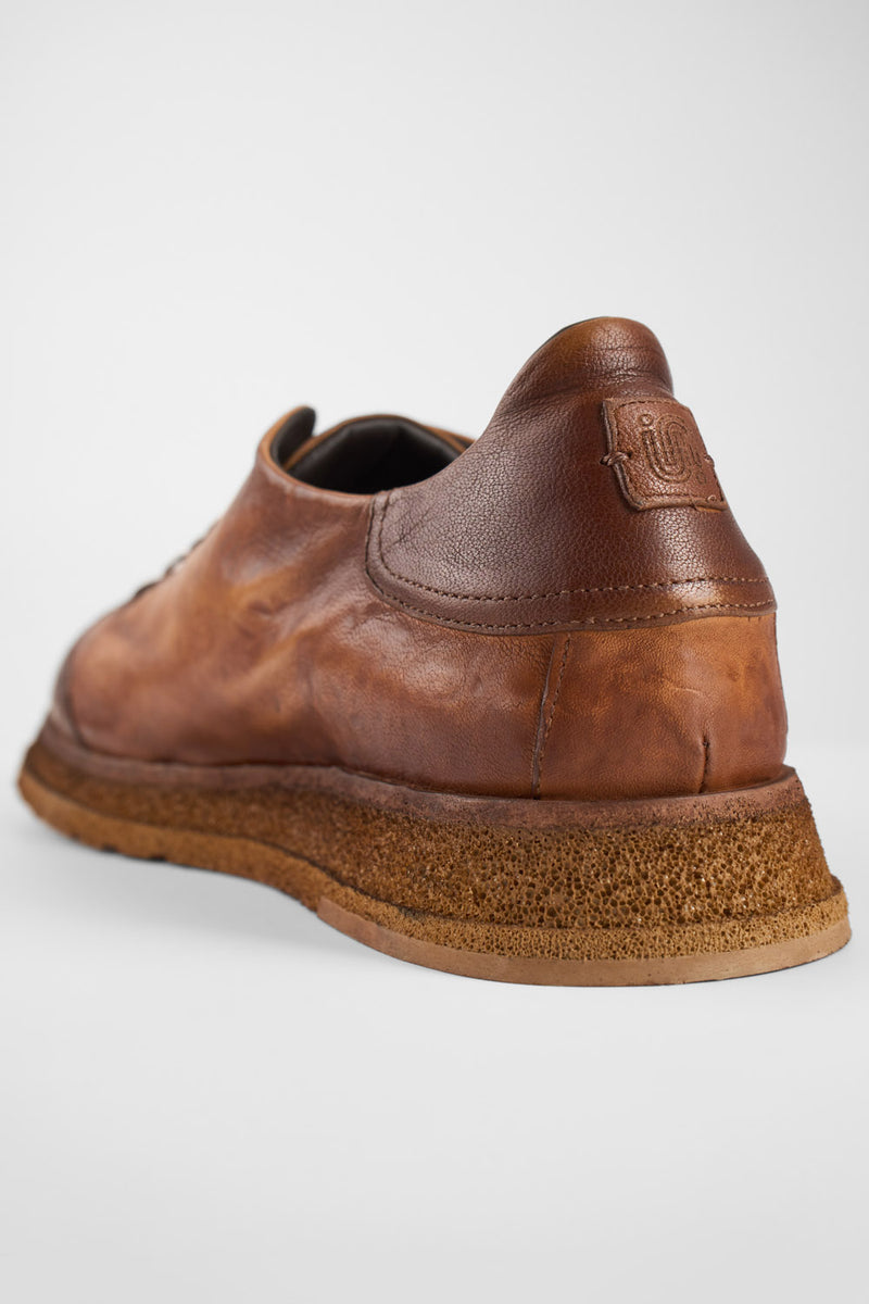 AJAX cognac distressed lightweight sneakers.