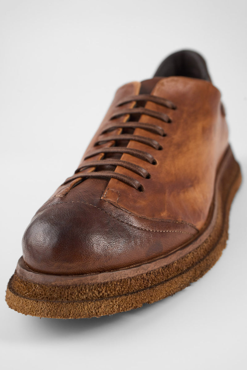 AJAX cognac distressed lightweight sneakers.