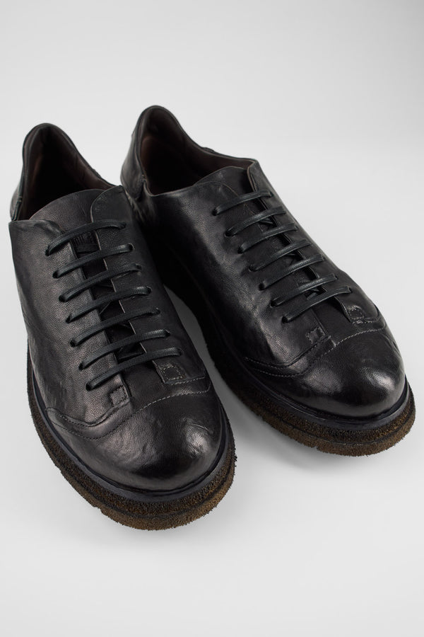 AJAX black distressed lightweight sneakers.