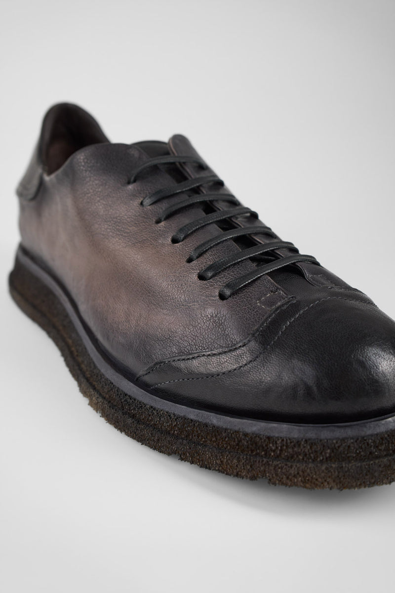 AJAX steel-grey distressed lightweight sneakers.