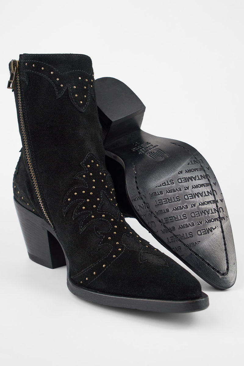 AUSTIN black suede studded texan boots.