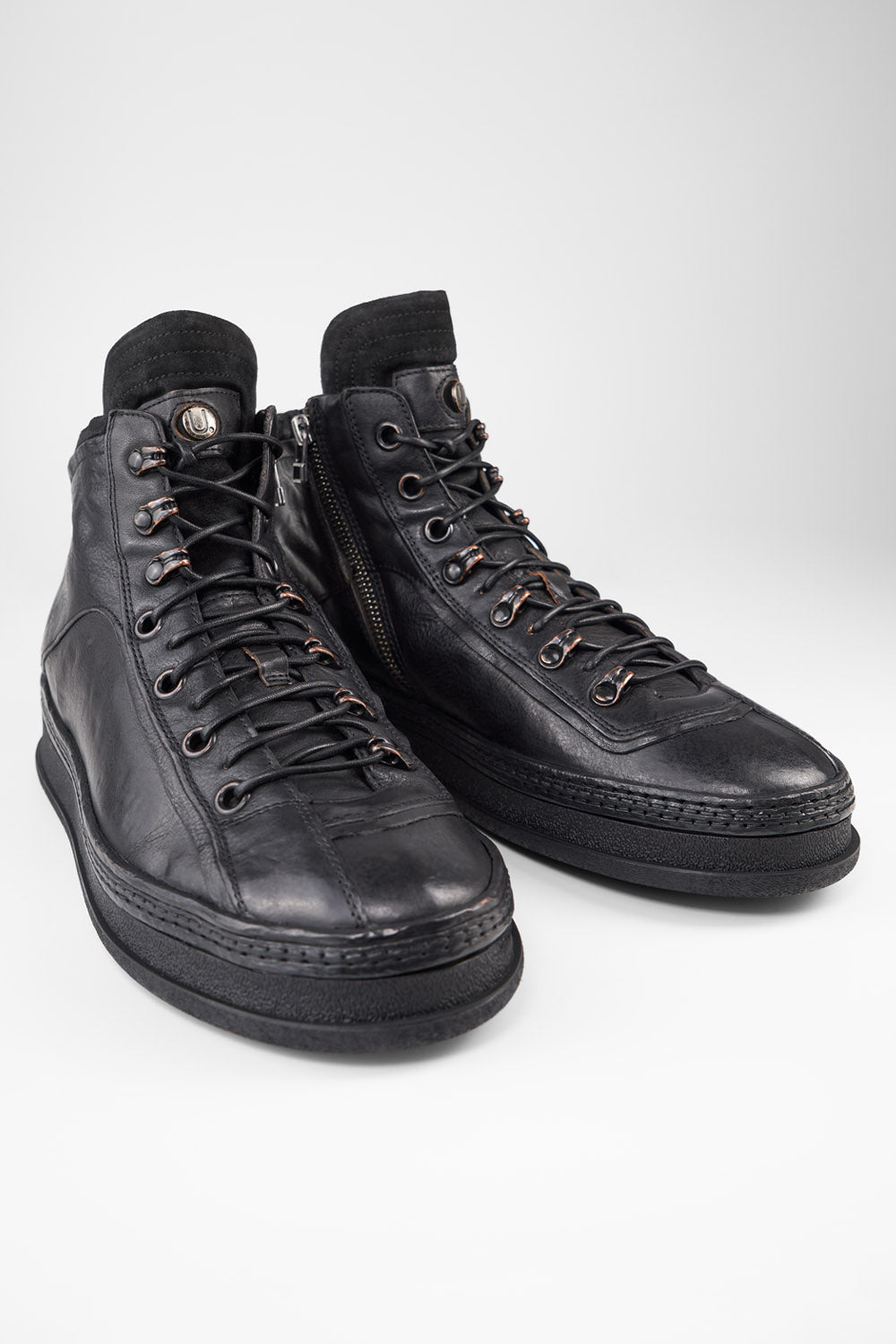 COLE urban-black asymmetric welted high sneakers.