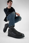 COLE rugged-black welted distressed sneakers.