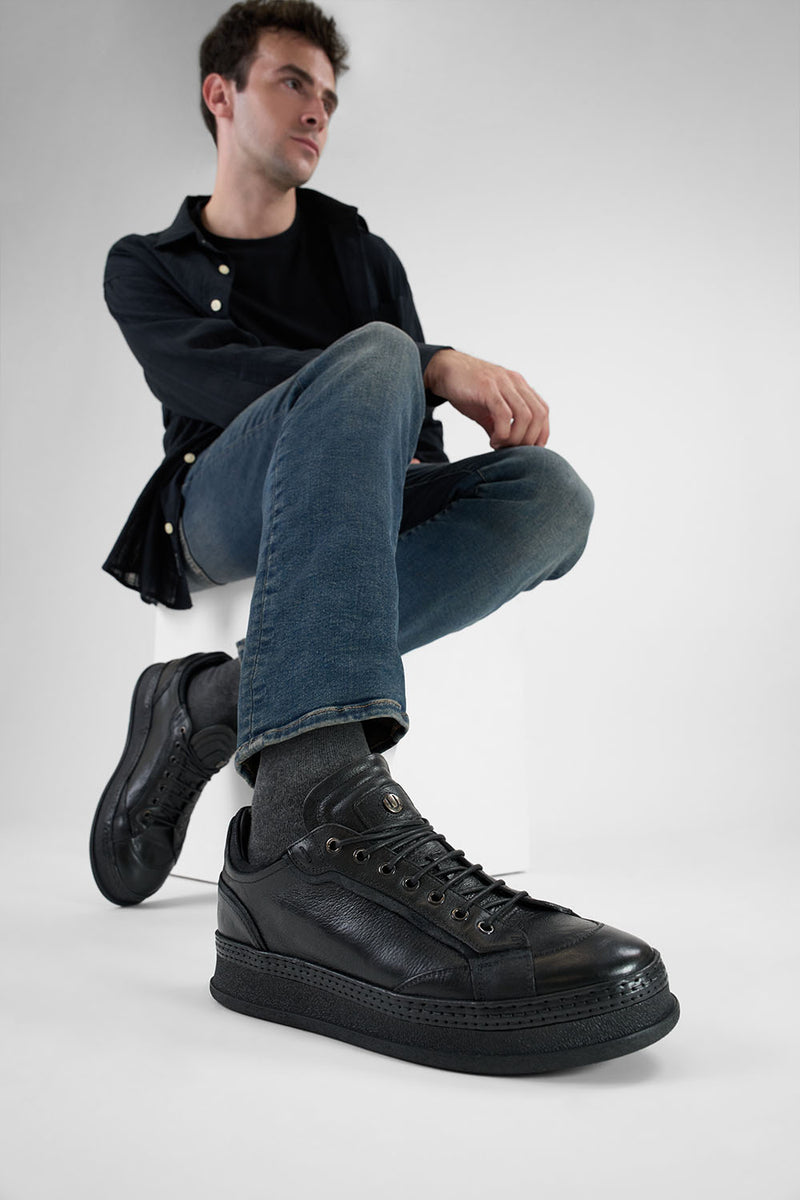 COLE rugged-black welted distressed sneakers.