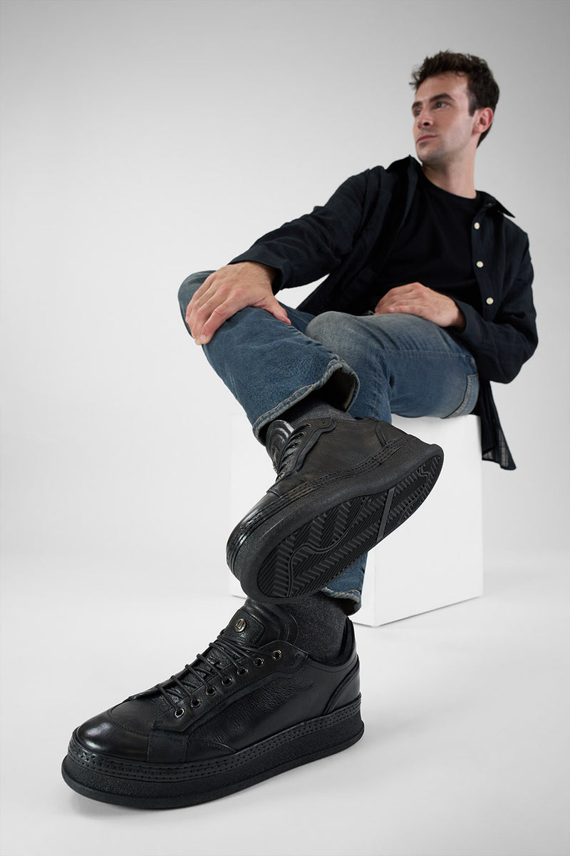COLE rugged-black welted distressed sneakers.