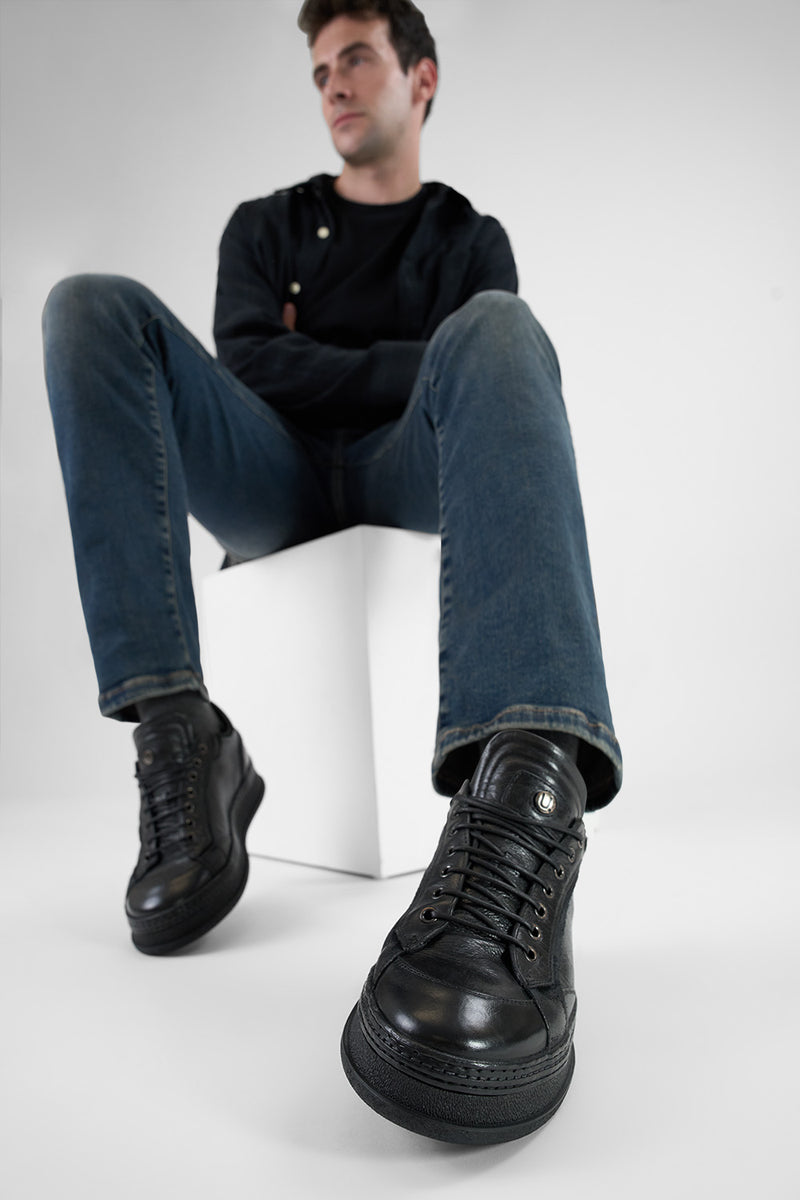 COLE rugged-black welted distressed sneakers.