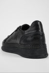 COLE rugged-black welted distressed sneakers.