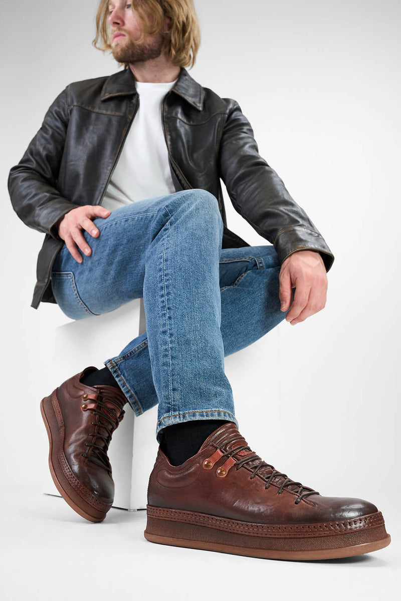 COLE cognac welted distressed loop sneakers.