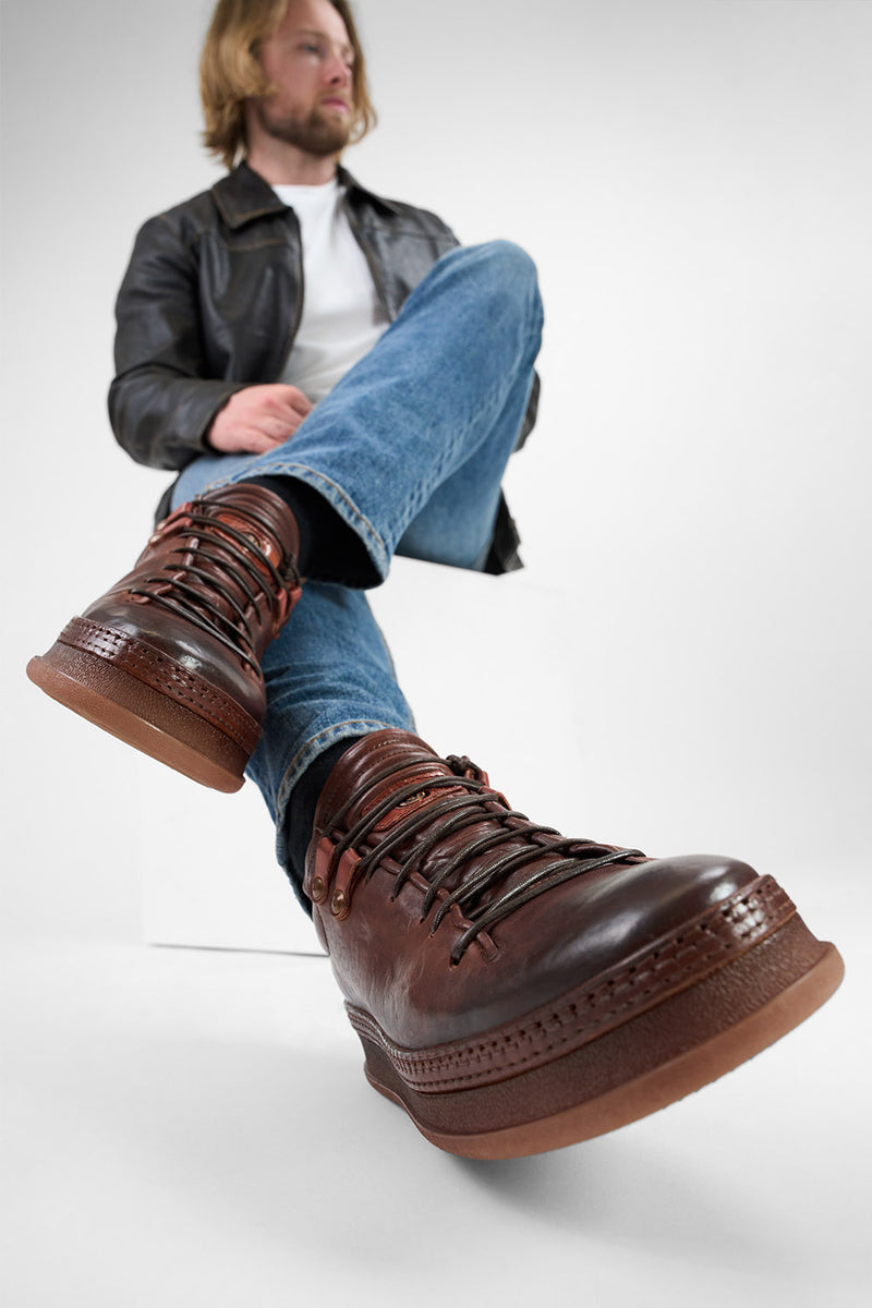 COLE cognac welted distressed loop sneakers.