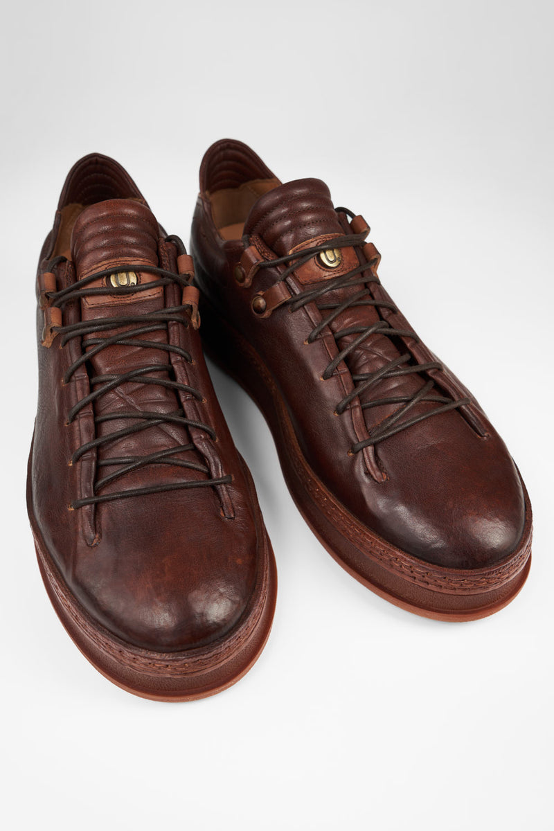 COLE cognac welted distressed loop sneakers.
