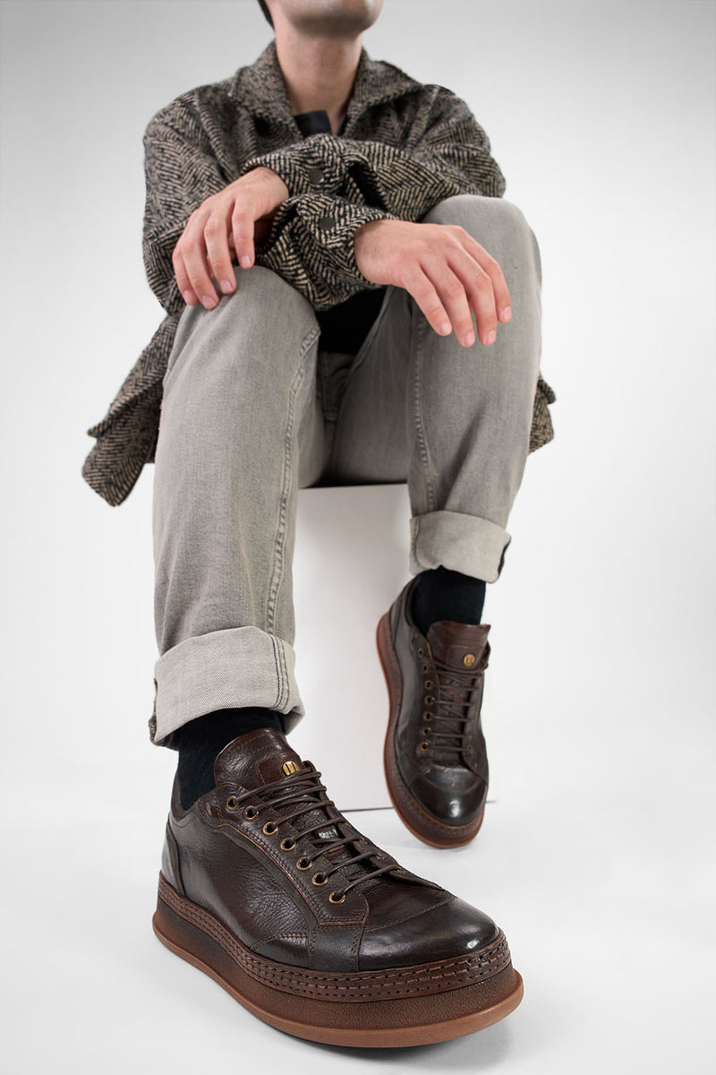 COLE dark-cocoa welted distressed sneakers.