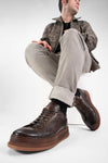 COLE dark-cocoa welted distressed sneakers.
