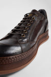 COLE dark-cocoa welted distressed sneakers.