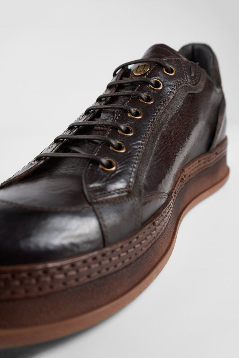 COLE dark-cocoa welted distressed sneakers.