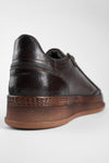 COLE dark-cocoa welted distressed sneakers.