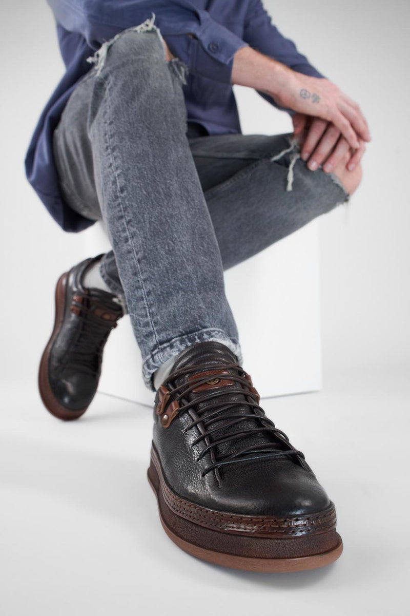 COLE dark-cocoa welted distressed loop sneakers.
