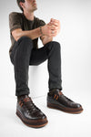 COLE dark-cocoa welted distressed loop sneakers.