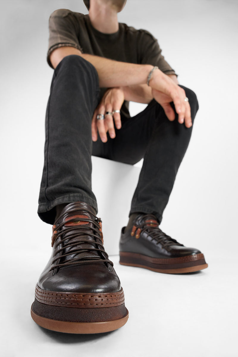 COLE dark-cocoa welted distressed loop sneakers.