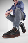 COLE dark-cocoa welted distressed sneakers.