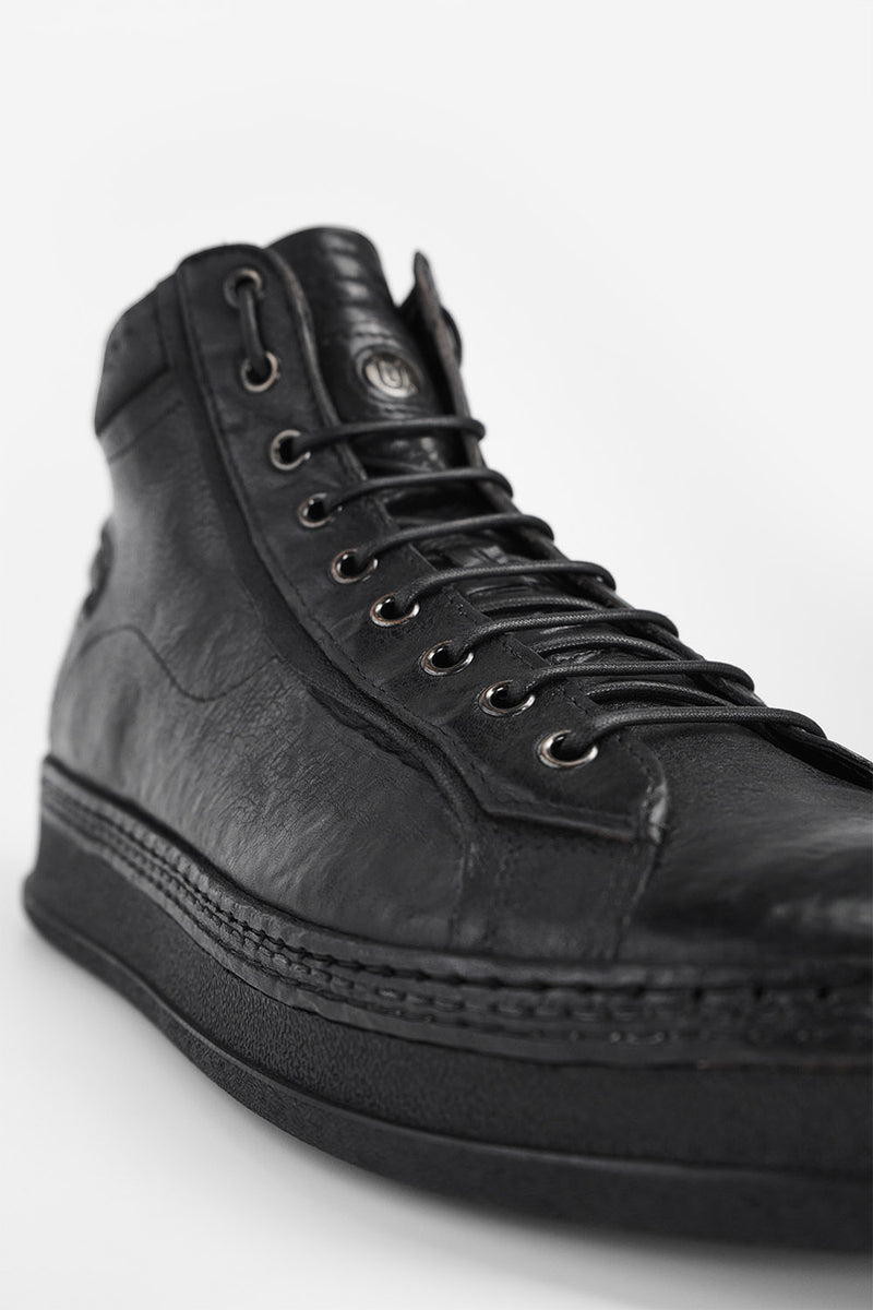 COLE rugged-black welted distressed high sneakers.