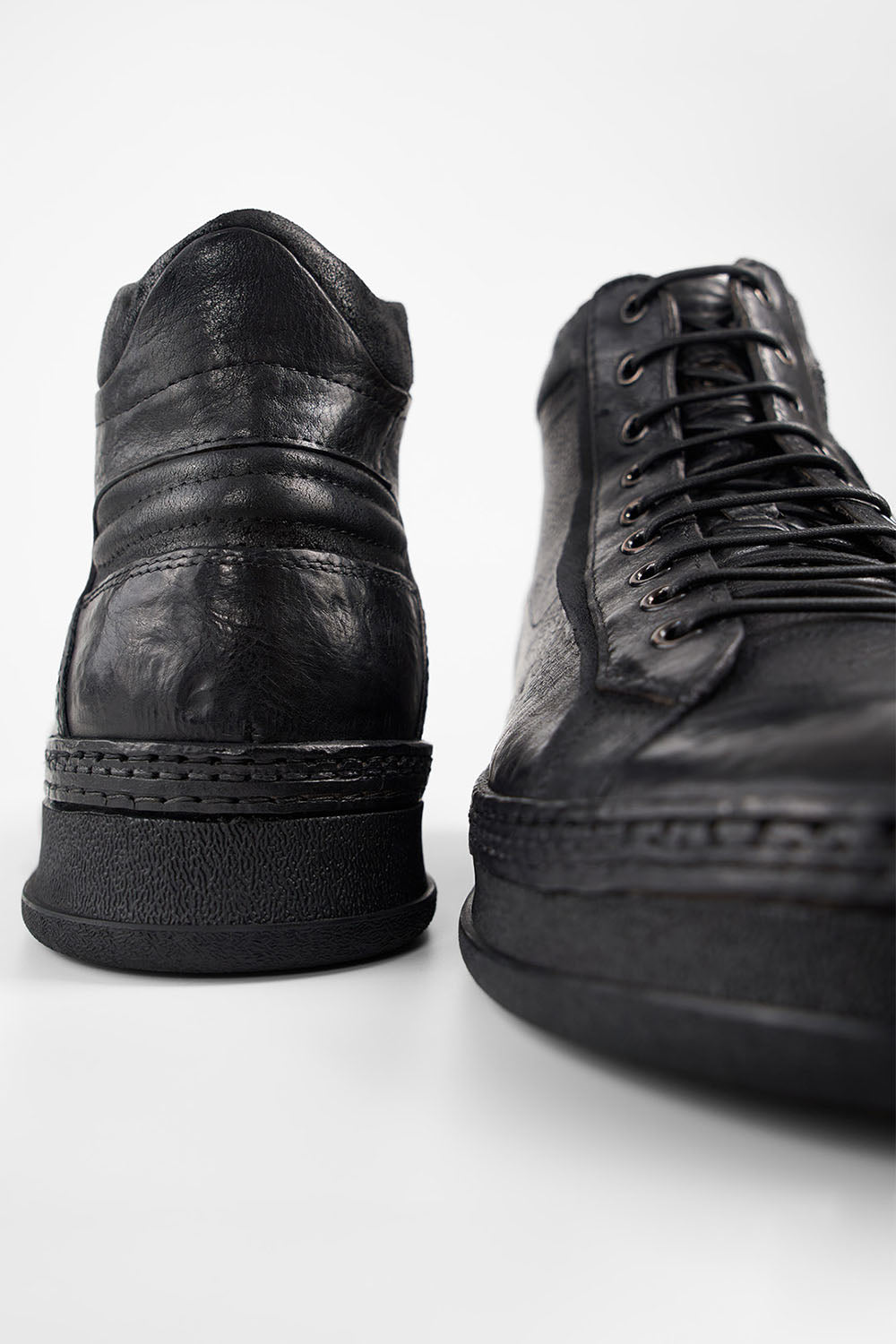 COLE urban-black welted distressed high sneakers.