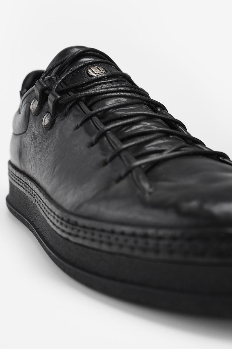 COLE rugged-black welted distressed sneakers.