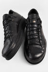COLE rugged-black welted distressed sneakers.