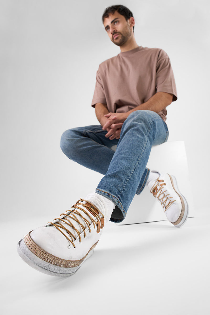 COLE white welted distressed loop sneakers.