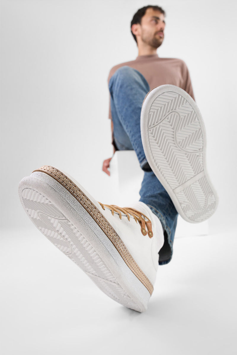 COLE white welted distressed loop sneakers.