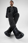 CREED jet-black distressed sneakers.
