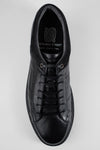 CREED jet-black distressed sneakers.