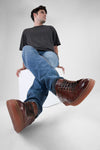 CREED cognac distressed sneakers.