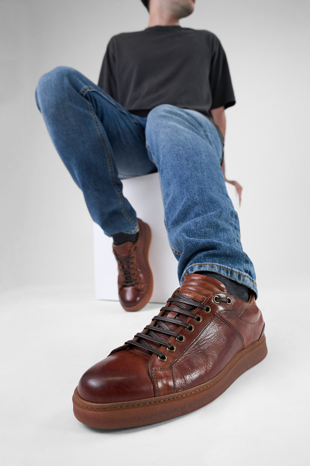 CREED cognac distressed sneakers.