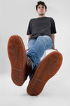 CREED cognac distressed sneakers.