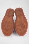 CREED cognac distressed sneakers.