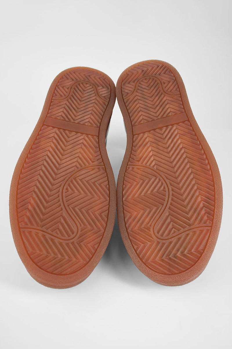 CREED cognac distressed sneakers.