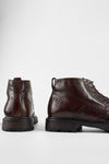 DRAKE dark-chestnut brogue chukka boots.