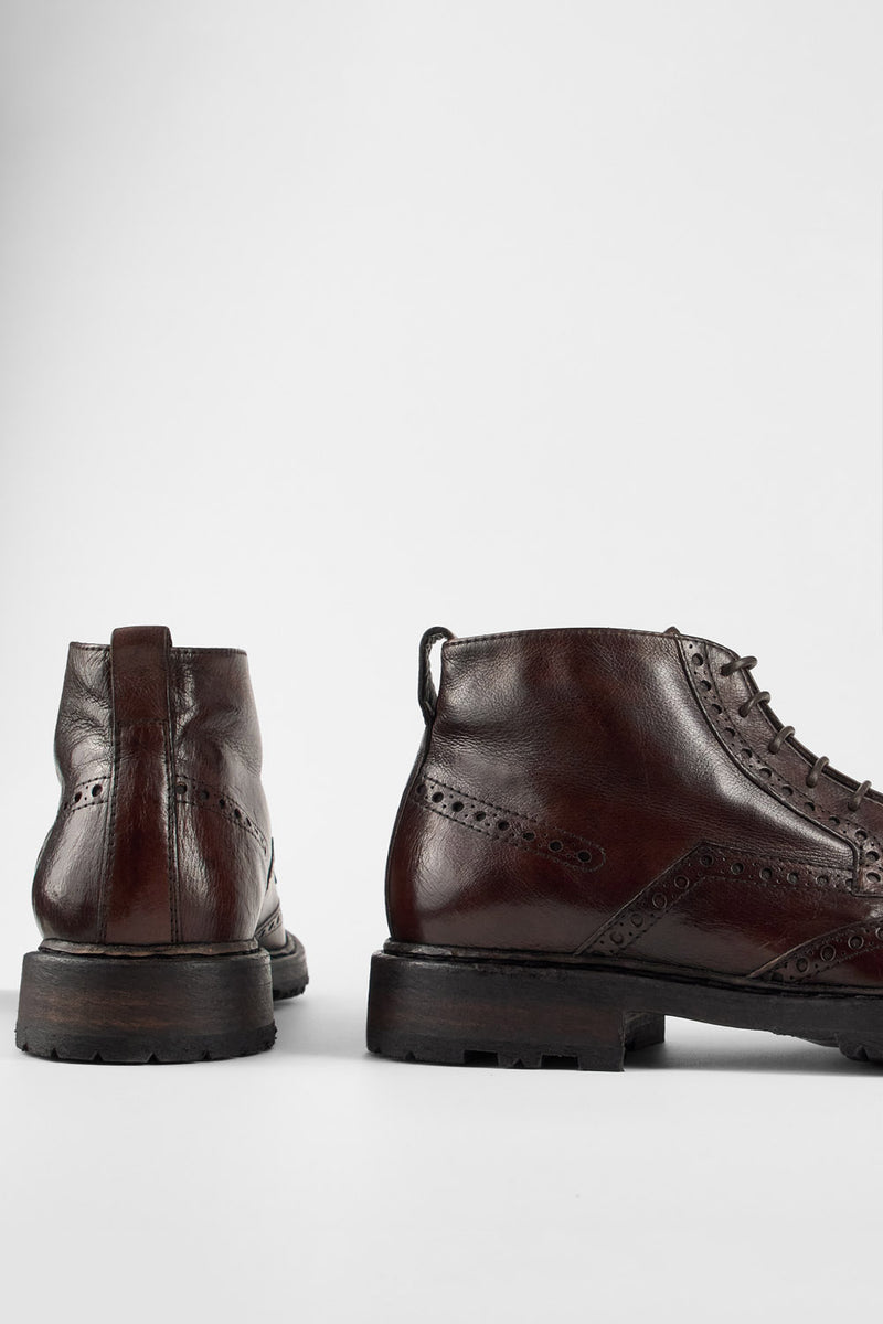 DRAKE dark-chestnut brogue chukka boots.