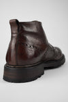 DRAKE dark-chestnut brogue chukka boots.