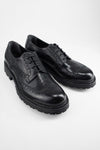 DRAKE jet-black brogue derby shoes.