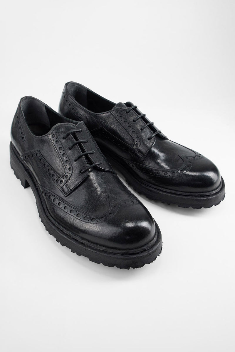 DRAKE jet-black brogue derby shoes.