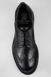 DRAKE jet-black brogue derby shoes.